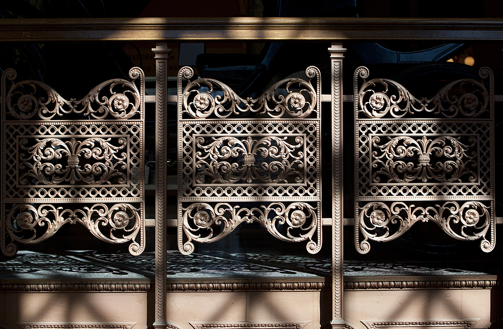 Stairwell wrought iron panels; sun and shadows