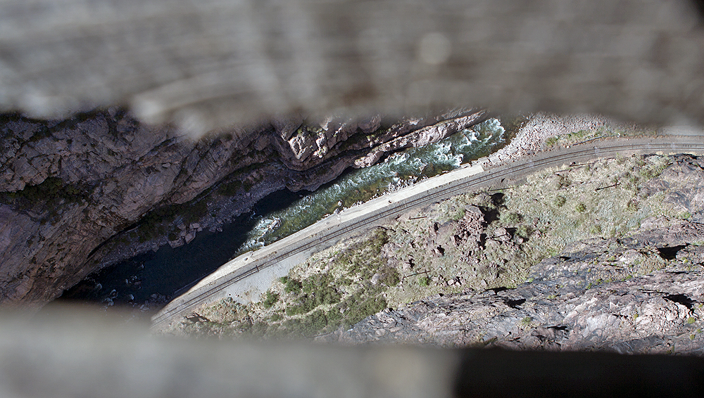 Arkansas River, rails from between the wooden slats of the bridge