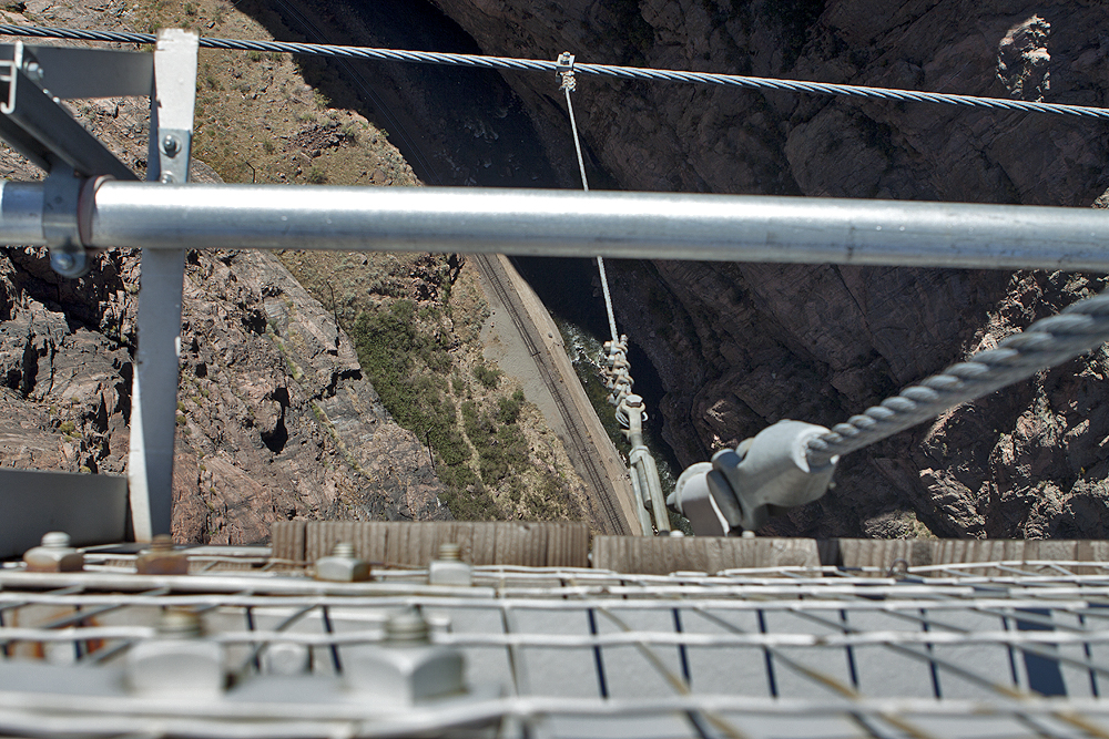 Look down - cables, rail, river, rocks and bridge