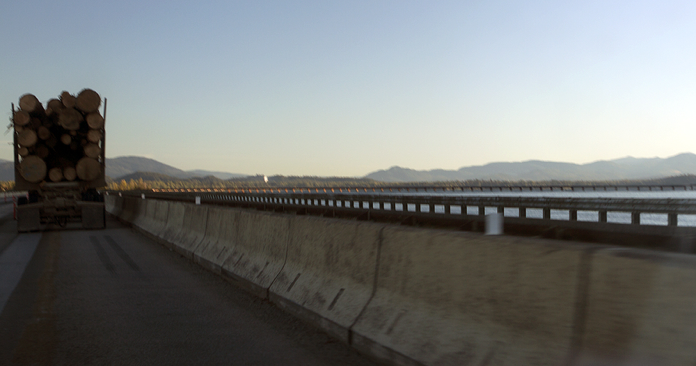 Road (we're on, behind lumber truck) and railroad bridge (in the distance)