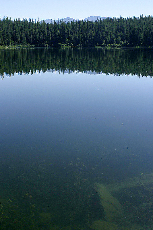 Clear water, mountains in the distance